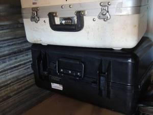 lot 33 image: a black insulated case and white insulated case
