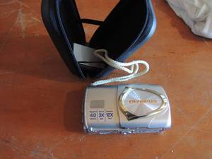 lot 83 image: Olympus Stylus digital camera w battery and case