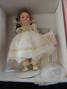 lot 349 image: MADAME ALEXANDER DOLL -  MY FIRST CHRISTMAS with LENOX ORNAMENT( MINITURE ANGEL)  8 DOLL IN BOX W COA