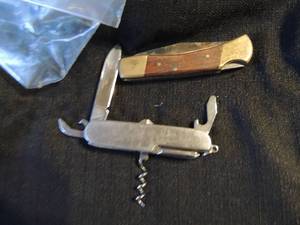 lot 341 image: KNIFE - MULTI TOOL- MARKED FOR GOULDS WATER TECHNOLOGY  & SINGLE BLADE 3 12 ( CANT OPEN) .