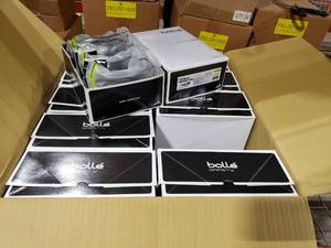 lot 37 image: Case of Approx 200 DSG Bolle Tryon ShootingSafety Glasses CSP - BlackTan.  20 Boxes  10 Glasses Per Box