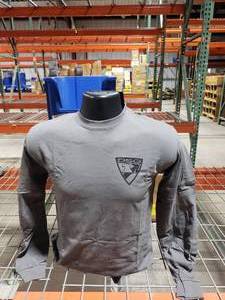 lot 44 image: Approx 14 DSG Arms Badge Logo Long Sleeve Shirts - Grey.  Misc Sizes.  See Decription For Sizes & Quantities.  Bins are NOT Included.