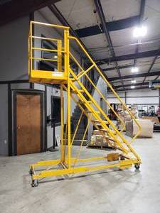 lot 55 image: TRI-ARC Rolling Cantilever Ladder w Locking Casters
