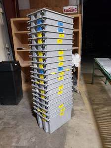 lot 82 image: Lot of 20 Grey Quantum Storage Systems SNT240 Stack & Nest Totes.  Measures 23.5 x 15.5 x 12