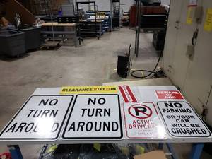 lot 103 image: Lot of Misc Parking & Warehouse Signs