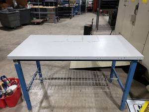 lot 104 image: Global Industries Adjustable Height Workstation.  Top Measures 60 x 30