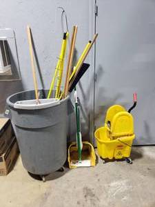 lot 121 image: Lot of Misc Cleaning Supplies.  Includes Rolling 50Gal Trash Can, Mop Bucket, Standing Dust Pan, Mop Handles & MORE