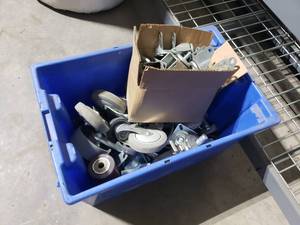 lot 131 image: Tub FULL of Heavy Duty Casters.  Tub Included.