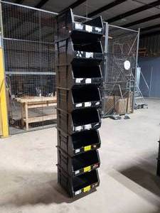 lot 318 image: Stack of 8 Uline S-12422 Black Stackable Bins.  Each Bin Measures 18 x 16.5 x 11