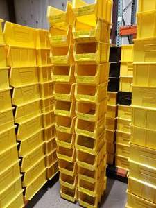 lot 397 image: Stack of 24 Uline S-12419 Yellow Stackable Bins.  Each Bin Measures 15 x 8 x 7.  Also might be a few Akro Bins, Global or Quantum bins mixed in but they are all the same dimensions.