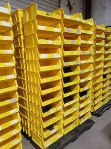lot 375 image: Stack of 24 Uline S-12420 Yellow Stackable Bins.  Each Bin Measures 15 x 16.5 x 7.  Also might be a few Akro Bins, Global or Quantum bins mixed in but they are all the same dimensions.