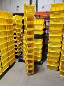 lot 395 image: Stack of 12 Uline S-12419 Yellow Stackable Bins.  Each Bin Measures 15 x 8 x 7.  Also might be a few Akro Bins, Global or Quantum bins mixed in but they are all the same dimensions.