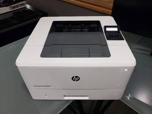 lot 569 image: HP Laser Jet Pro M402n Printer.  Test Page Printed.
