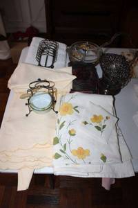 lot 70 image: Yellow and white table linens plus serving dishes and silverplated items