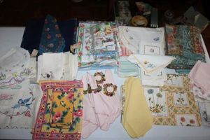 lot 68 image: Floral Table linens with beaded napkin rings
