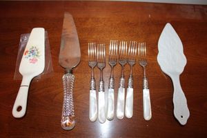 lot 32 image: Cake servers and pearl handled forks