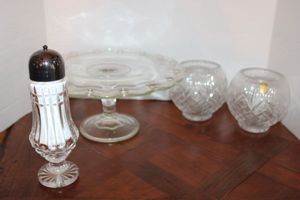 lot 58 image: Lead crystal shaker, Lead crystal bowls with votive candles and Clear cake plate