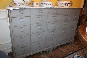 lot 80 image: Cabinet with drawer contents (mostly cookie cutters) - 56x18x35