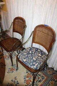 lot 83 image: Cane back chairs with heavy iron frame