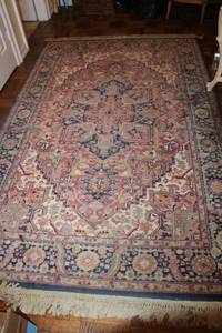 lot 22 image: Area rug (Looks like AMERICAN KARASTAN HERIZ PATTERN #726 RUG) - pink and blue colors. 92x69 approx.