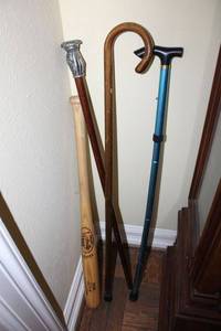 lot 15 image: Walking canes and Louisville Slugger bat, see photos