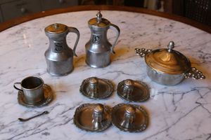 lot 101 image: Pewter salt and pepper shakers, mini shakers and plates and more