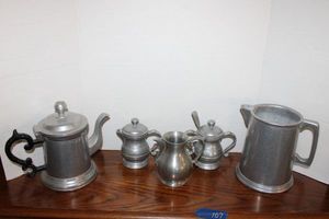 lot 107 image: Pewter pitchers, cream and sugar servers