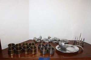 lot 106 image: Pewter ladle, pewter napkin rings and brass napkin rings