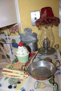lot 120 image: Household items Pewter oil lamp, pewter letter holder, mini copper pan, ceramic cupcake