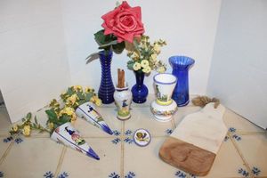 lot 130 image: HB Henriot Quimper France flower sconces, vases, and blue glass vases plus cutting board paddle