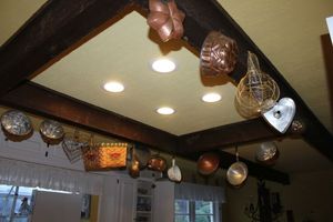 lot 154 image: Kitchen items molds and decorations hanging in kitchen