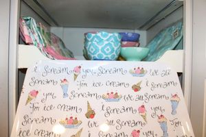 lot 156 image: Ice cream tray, polka dotted bowls and Spring colored table linens