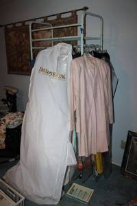 lot 397 image: Rolling clothes rack with clothes - includes wedding dress slip