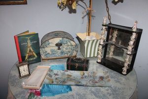 lot 404 image: Home dcor Mens handkerchief, Paris book, small brass clock, Paris dish, antique display shelf with porcelain columns, wooden boxes, artificial orchid plant