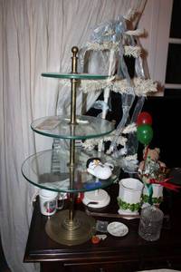 lot 414 image: Home dcor Heavy brass and 3 tier glass shelf table, Christmas vases, lead crystal candy dish, Mercedes Benz key chain, and more