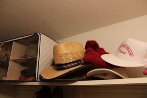 lot 446 image: Hat collection, Oscar Mayer beach umbrella, small flags and more