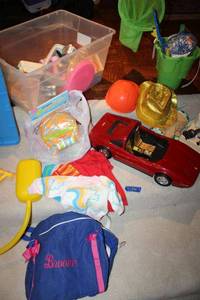 lot 321 image: Toy lot includes Barbie Ferrari car and plush Grogu Star Wars toy