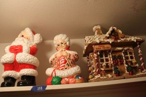 lot 338 image: Christmas decorations gingerbread house, Santa and Mrs. Claus ceramic figurines