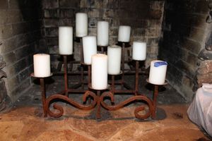 lot 222 image: Iron fireplace candelabra with white candles