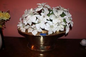 lot 229 image: Large flower arrangement. Oval Brass colored pot with white poinsettias