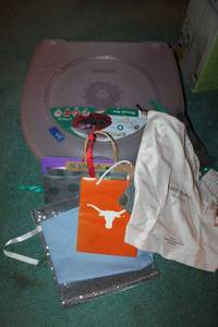 lot 275 image: 2 plastic wreaths storage containers and extra gift bags