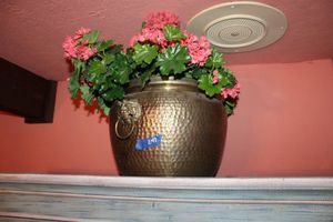 lot 241 image: Hammered brass planter with flowers