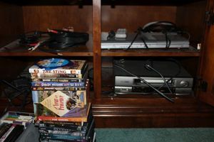 lot 236 image: Electronics - VHS and DVD players, DVDs and VHS movies, plus extra cables
