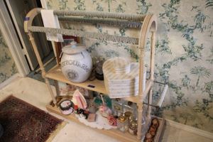 lot 483 image: Towel stand with cane shelves (contents in next lot)