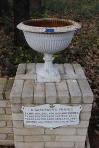 lot 596 image: Cast iron planter and gardeners prayer sign (bring tools to remove)