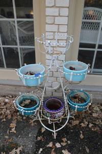 lot 594 image: White plant stand with planters as shown