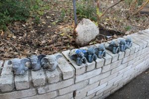 lot 603 image: Garden cherubs and garden stone
