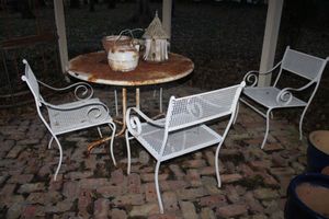 lot 638 image: Patio table and 4 heavy iron chairs
