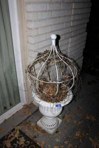 lot 671 image: Pair of wrought iron garden urns with wire trellises