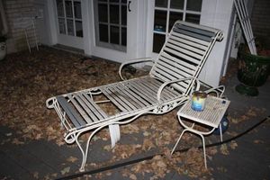 lot 675 image: Lounge chair with side table as shown